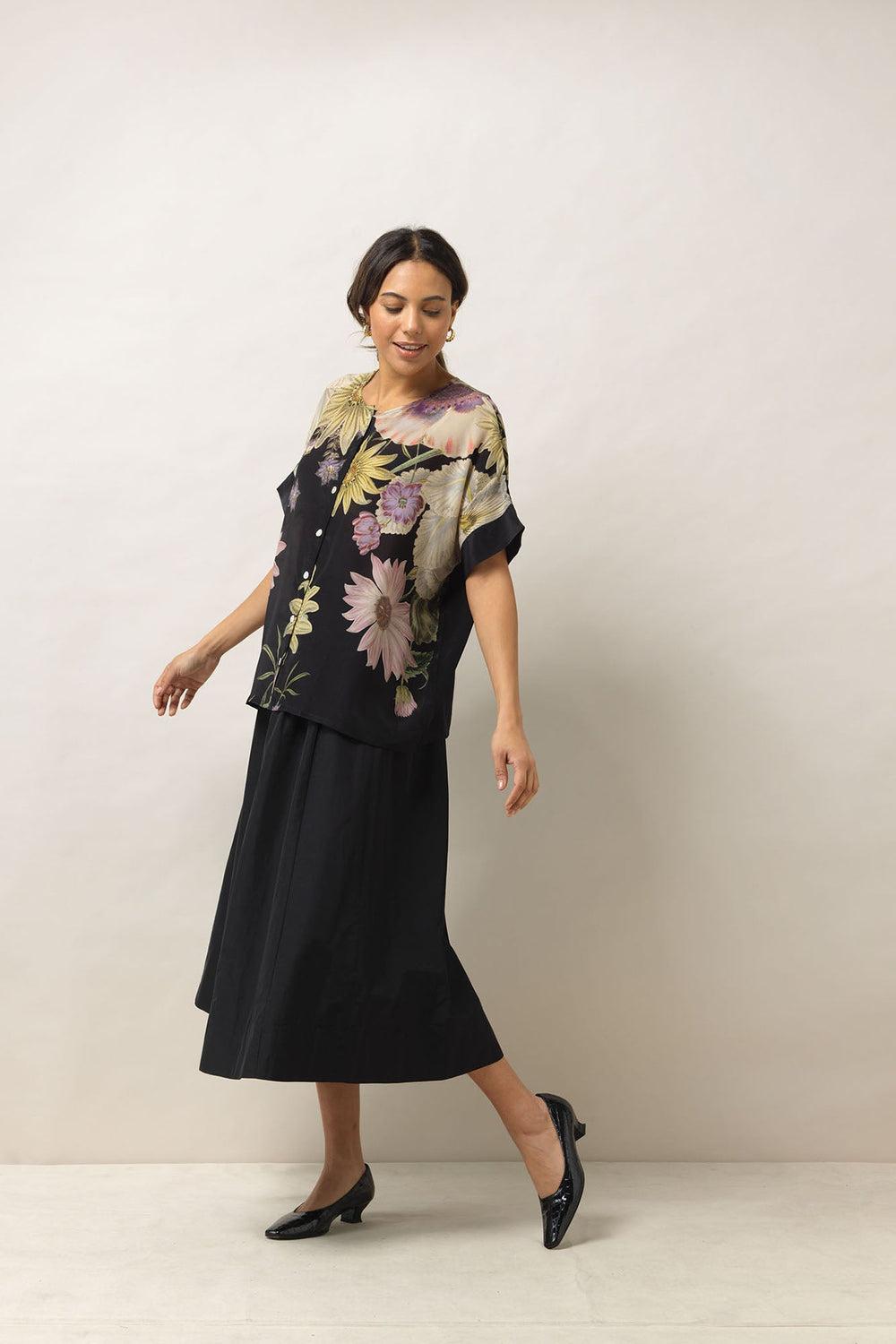 Women's button up short sleeve blouse in black with daisy floral print by One Hundred Stars