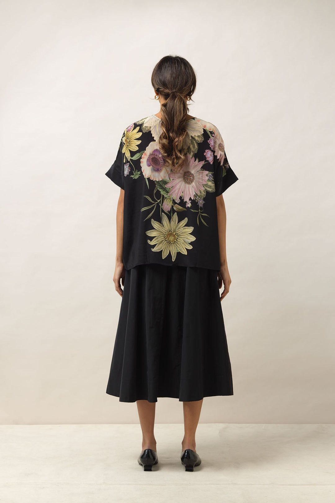 Women's button up short sleeve blouse in black with daisy floral print by One Hundred Stars