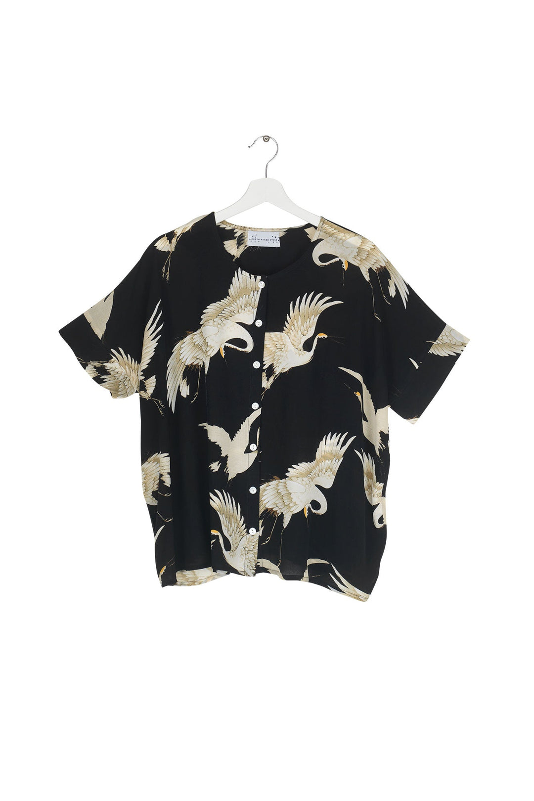 Women's short sleeve button up blouse  in black and white stork print by One Hundred Stars