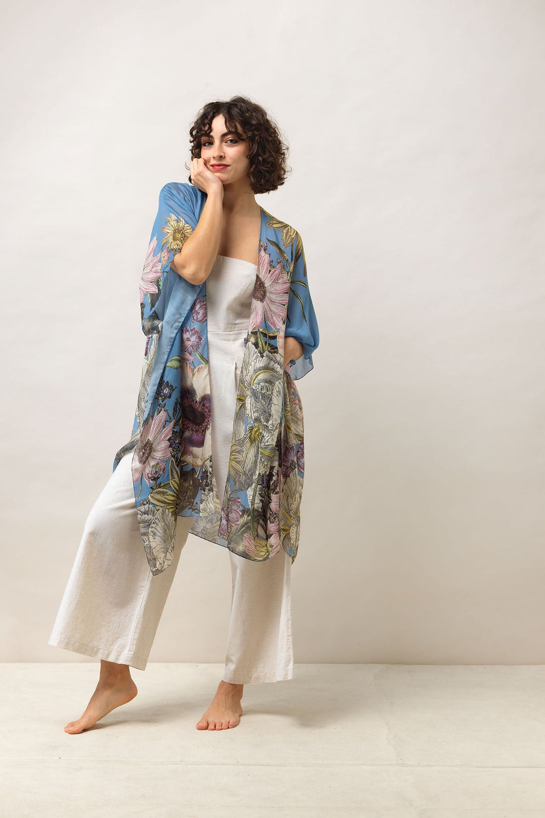 Women's lightweight throwover shawl in cornflower blue with daisy floral print by One Hundred Stars
