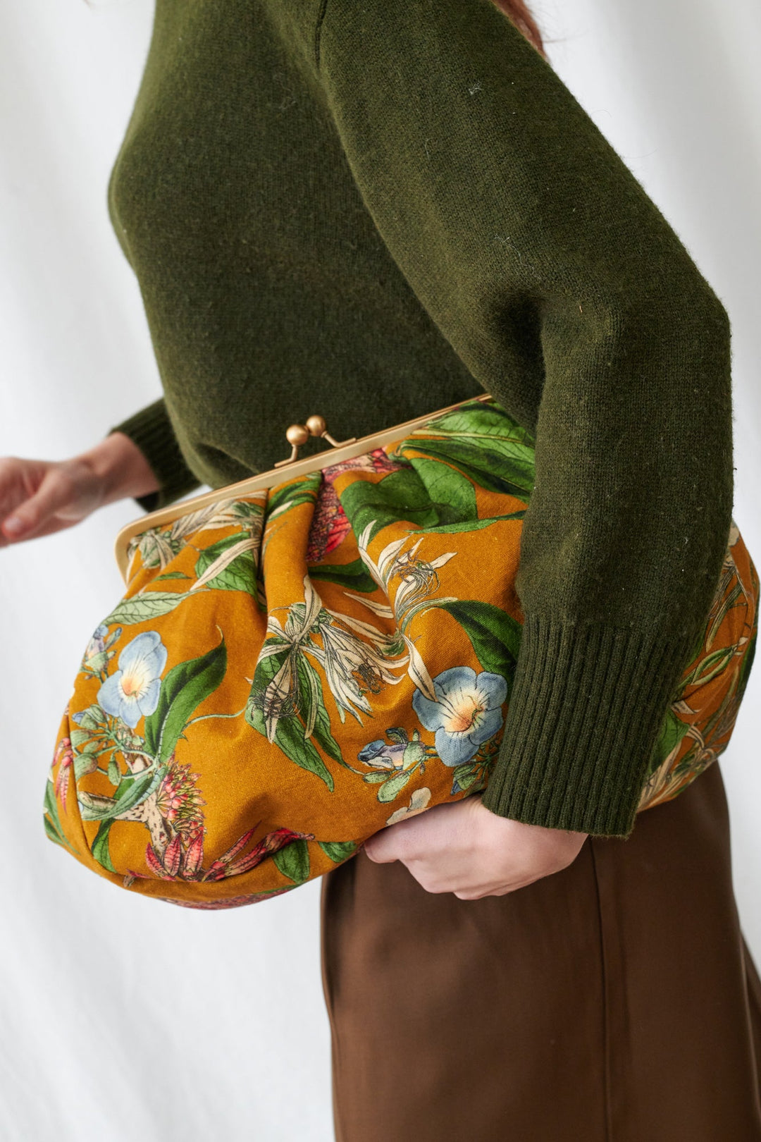 Rhodoleia Gold Kiss Lock Clutch Bag