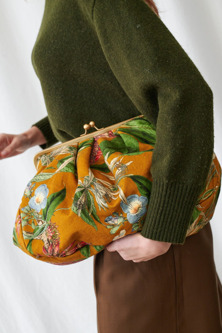 Rhodoleia Gold Kiss Lock Clutch Bag