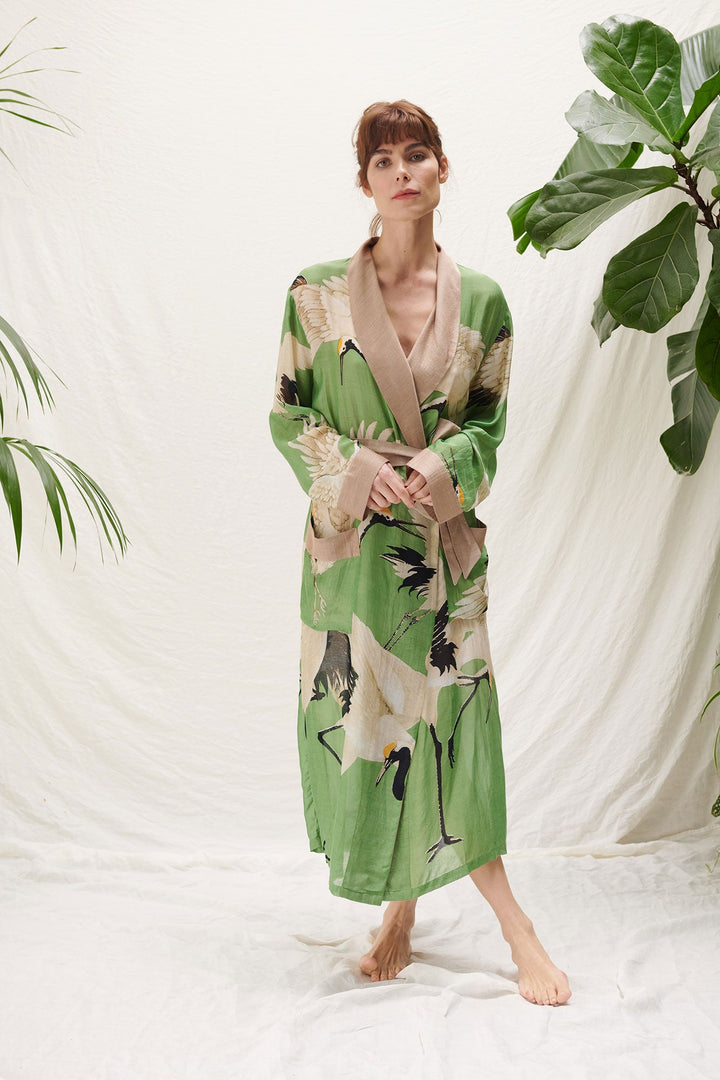 pea green stork gown by one hundred stars