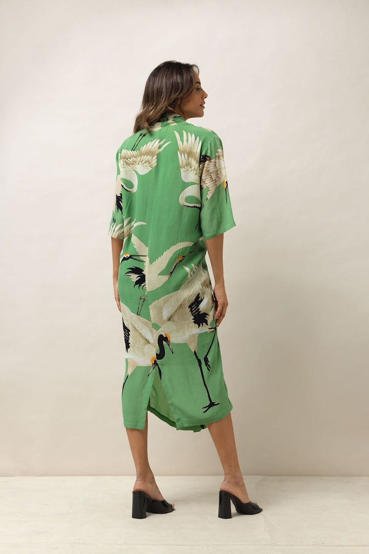 Women's long cowl neck short sleeve dress in pea green and white stork print by One Hundred Stars