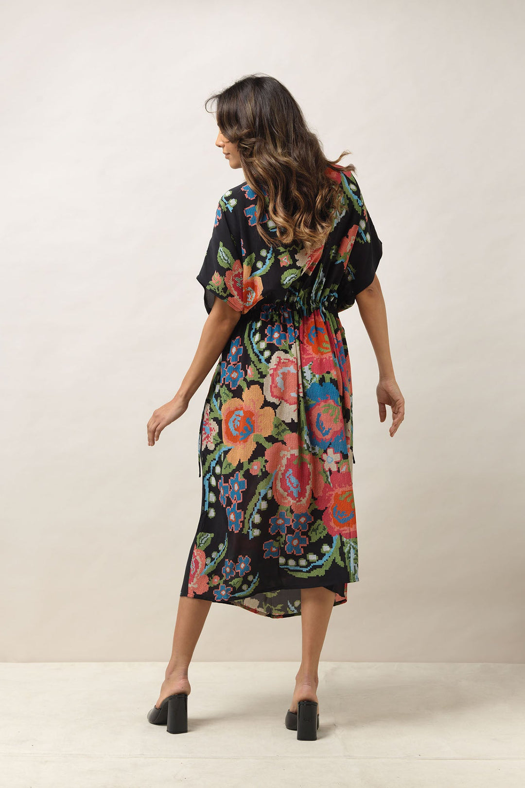 Women's lightweight beach cover up dress with tie waist in black with a colourful woven flower print by One Hundred Stars