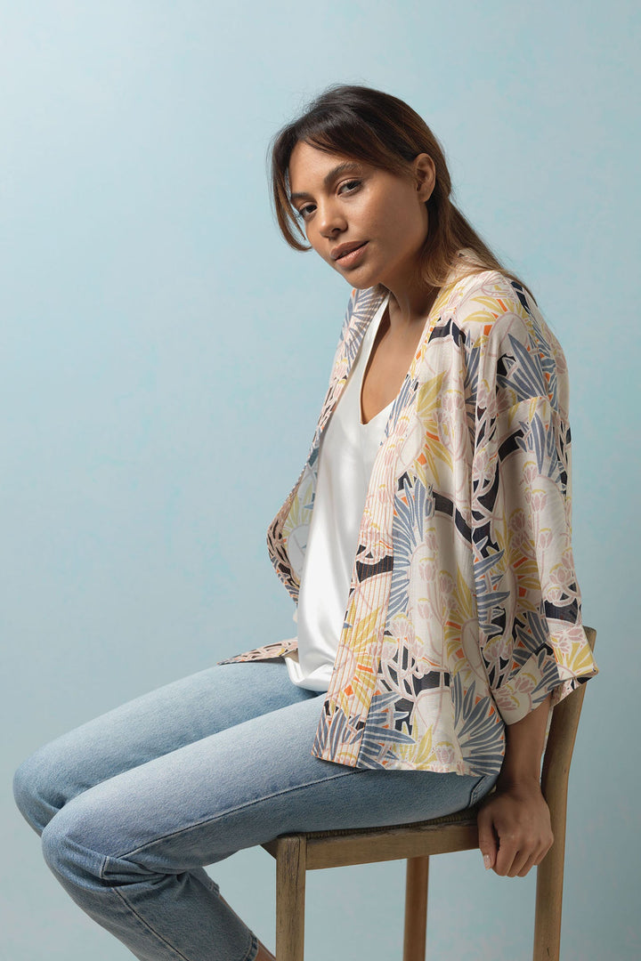 Vintage inspired print featuring art deco style flowers in delicate pastels colours on an easy to wear kimono jacket. 