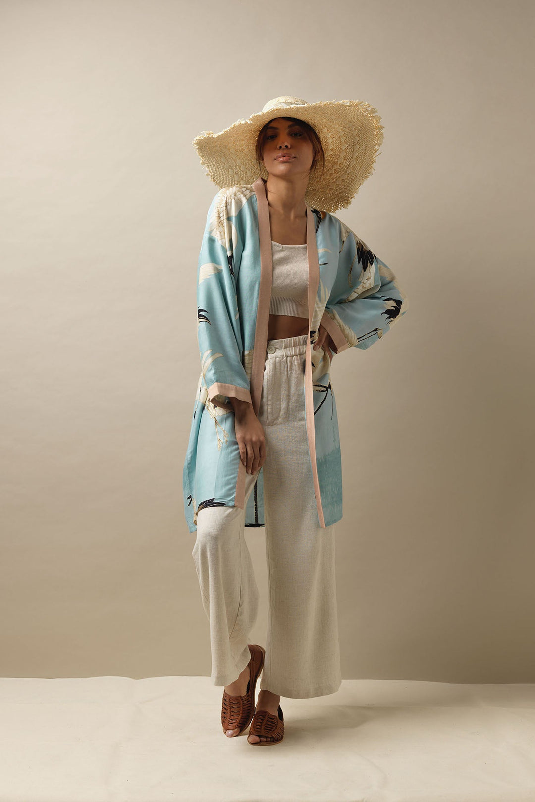 One Hundred Stars Stork Crane Sky Blue Collar Kimono can be paired with summer linen trousers and accessorised with a women hat to provide an easy to wear luxurious look this season. 